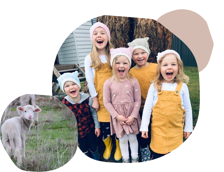 Children wearing Leroy Mac Designs beanies and a lamb