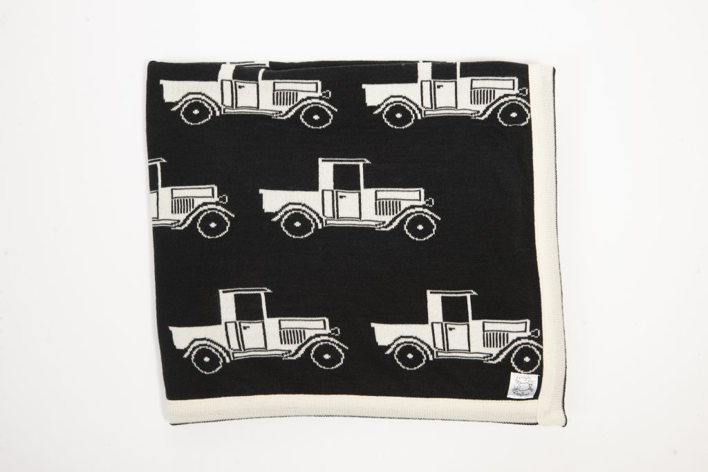 Black blanket with cream edging and cream Ford A model truck print
