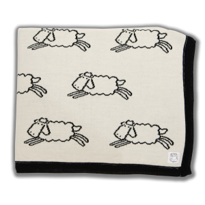 Cream blanket with black edging and black sheep pattern