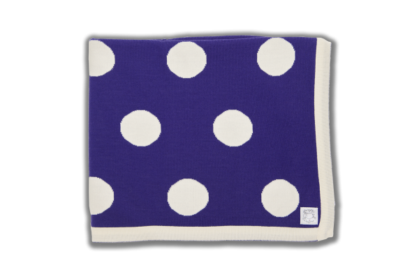 Purple blanket with cream edging and spots