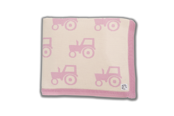 Cream blanket with pink edging and pink tractor print
